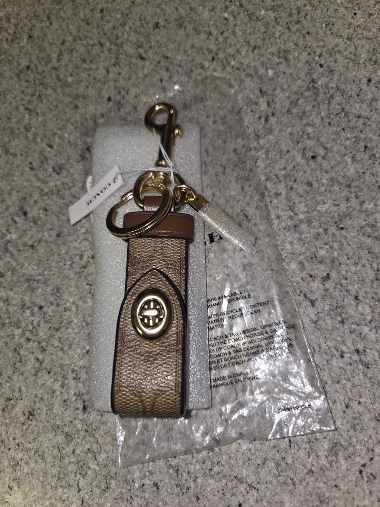 Coach Trigger Snap Bag Charm In Signature Canvas