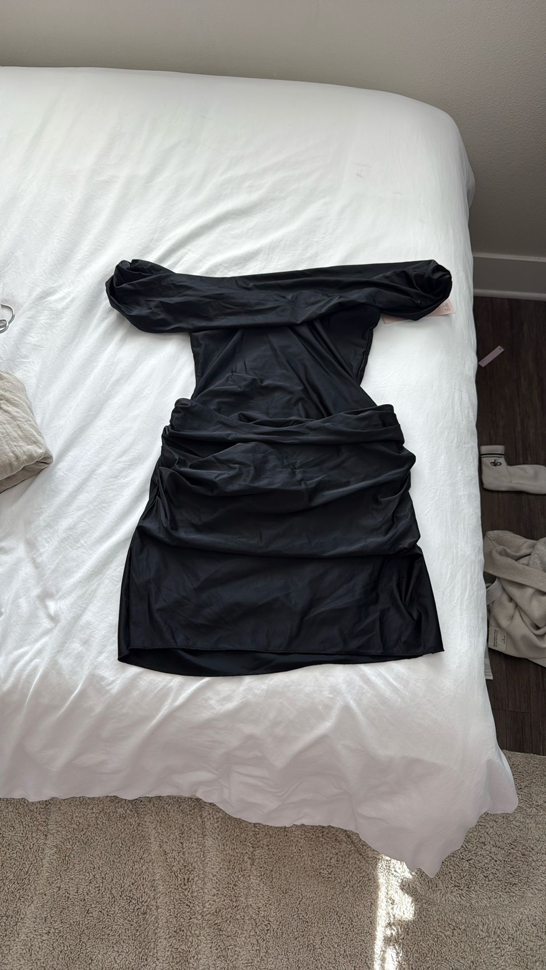 OhPolly Off-Shoulder Draped Mini Dress in Black