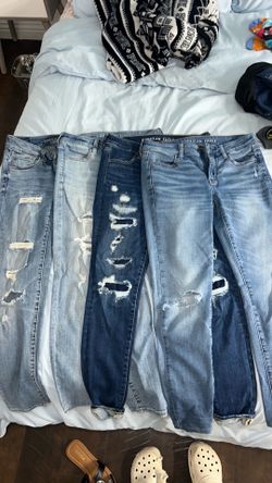 4 pairs American Eagle high-waisted skinny jeans with ripped knees