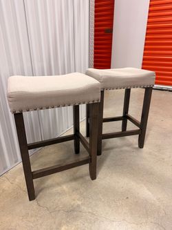 2 low gray bar stools
