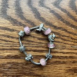 Silver Bracelet In Pink With Angel, Little Girl, Flowers, And More Charms