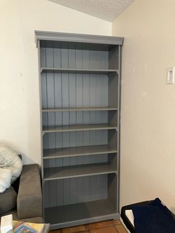 Gray book shelf 7’ x 15” x 38”