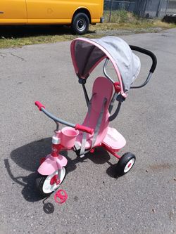Pink radio flyer trike with parent push handle