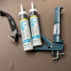 Caulk with gun and tool