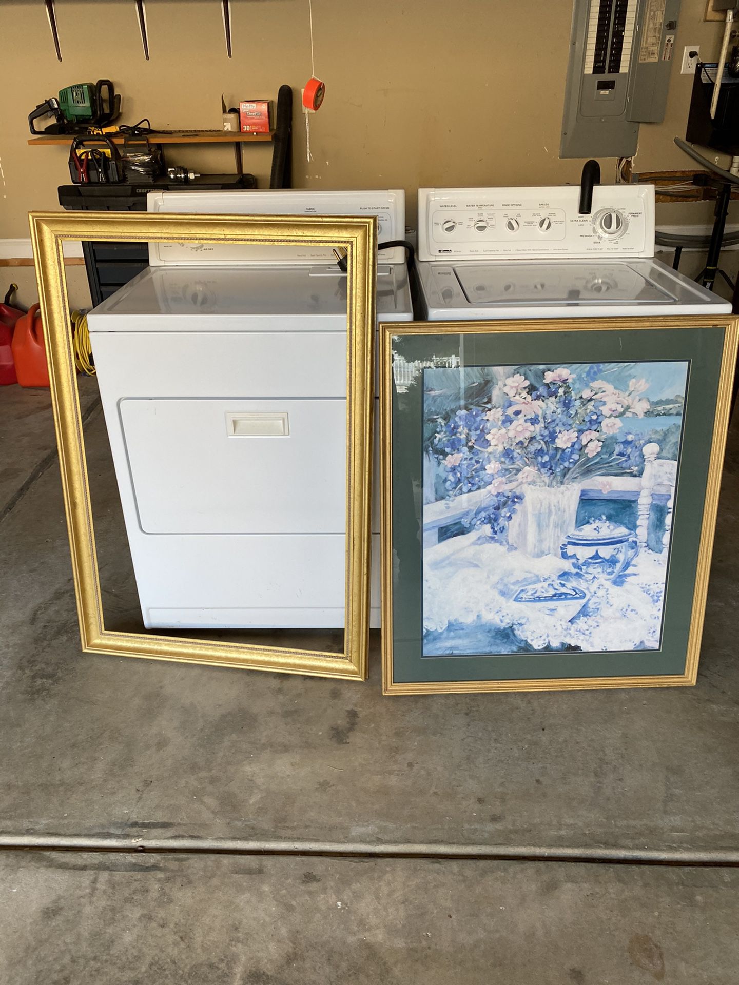 Two gold color picture frames