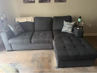 Couch with chaise lounge/storage and sleeper