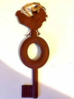 Metal rooster decor about 8 inches long