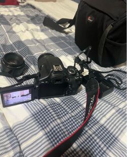 EOS T31 Camera With Extra Lens And Camera Bag