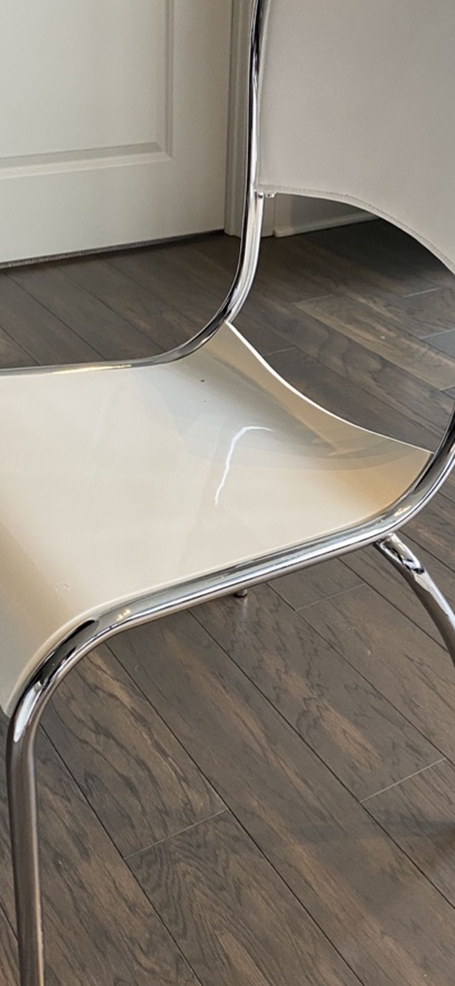 Beautiful White Chair With Chrome Legs And Leather Back