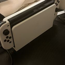 Nintendo switch oled with grip and pro controller