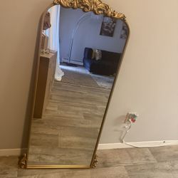 Gold ornate full-length mirror