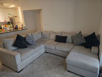 Sectional couch with pillows