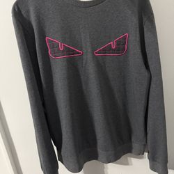 Grey Fendi crew neck sweater with pink eyes