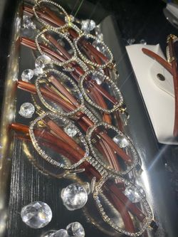 Millionaire Celebrity Glasses “Look Like Money” One (1) Unisex wooden frame with sparkling lab, diamond ice trim. Comes with a white protective case f