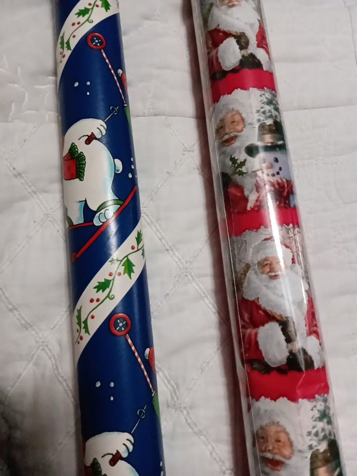 2 Rolls Of Christmas Wrapping Paper, One Is New
