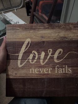 Love Never Fails Rustic Wood Sign