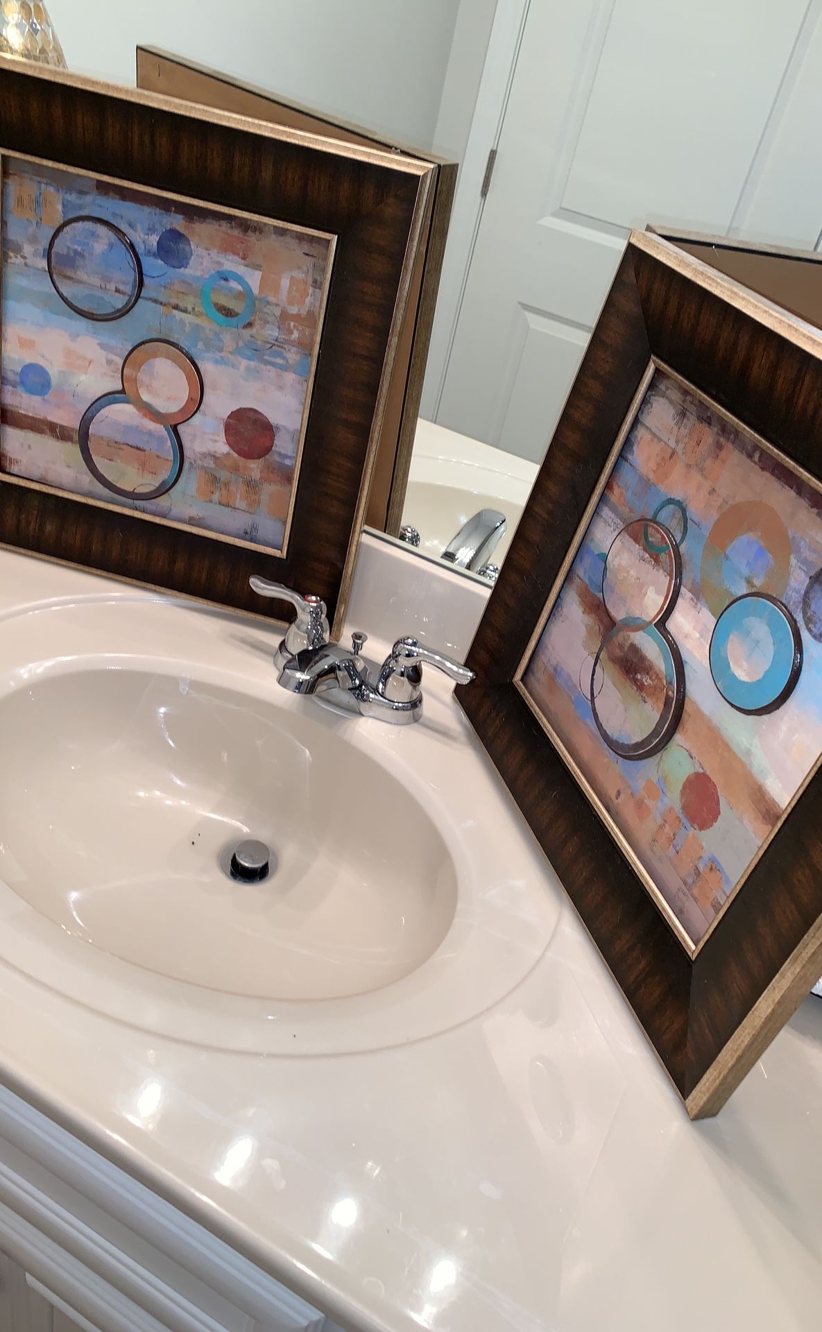 A set of two beautifully framed wall art. 55