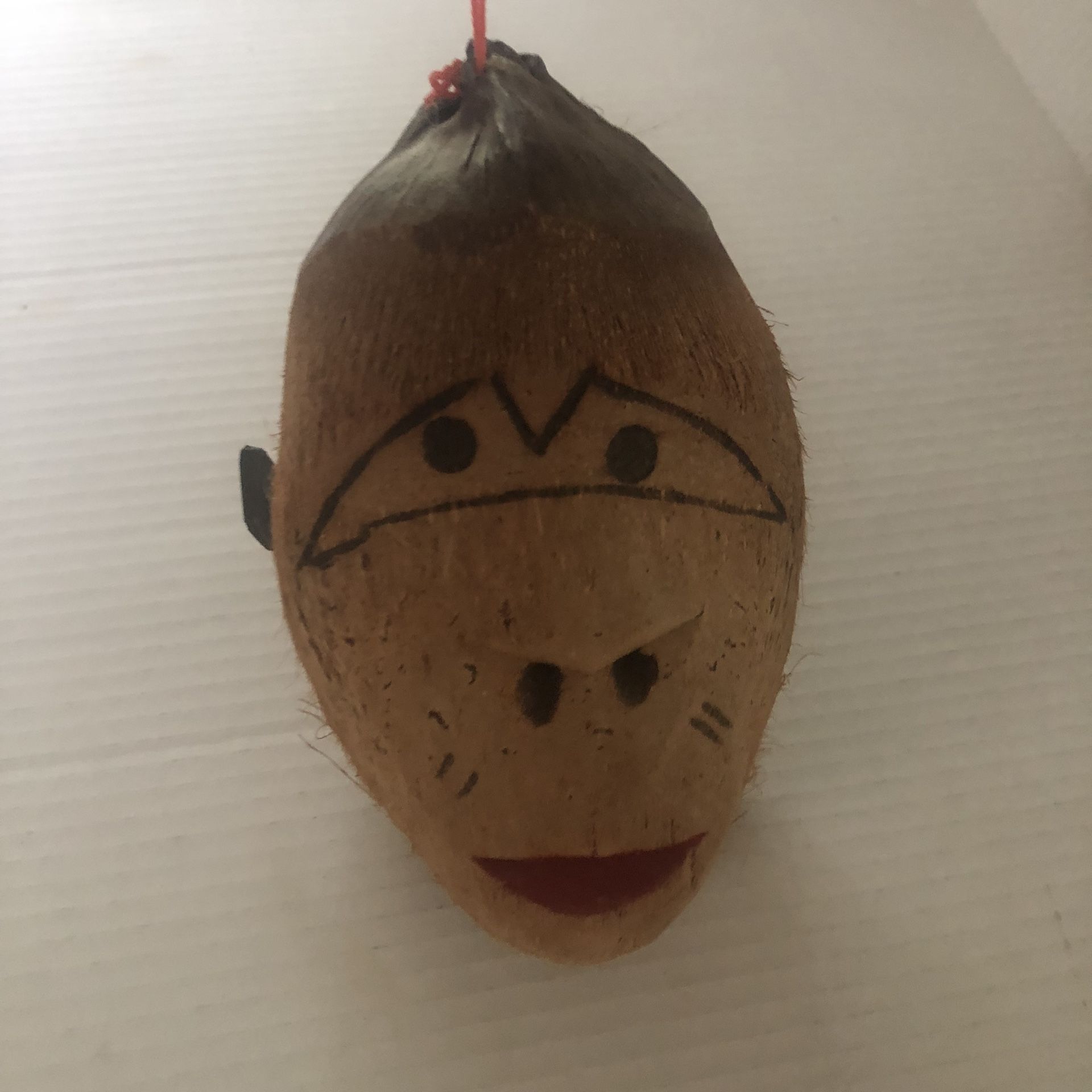 Coconut, carved monkey face, tiki bar decor