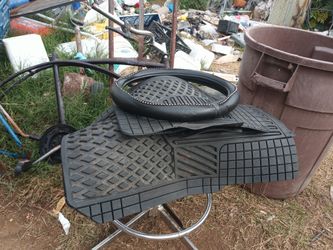 Full set of floor Matt's and a steering wheel cover like new for sale for 25