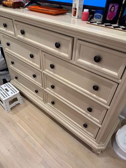 Large Cream Wood Dresser with Dark Knobs