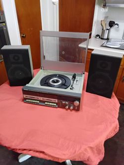 Vintage stereo.  Record Player and radio work