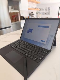 Microsoft surface windows with keyboard and pen