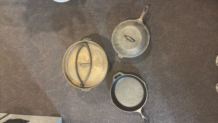 Cast Iron Dutch Oven with legs plus 2 skillets
