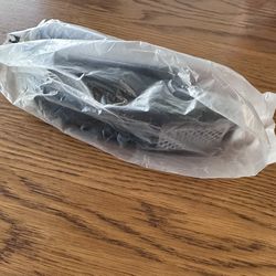 $20 - New Tupperware Ergonomic Garlic Wonder Press.  Three in one design, mince, crush & peel garlic with ease.  Color - Black.  Please pick up in the