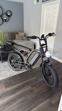 E-Bike w/additional seat fits 3 people.