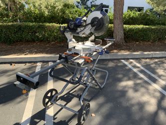 12” Kobalt miter saw on Rigid folding roller stand