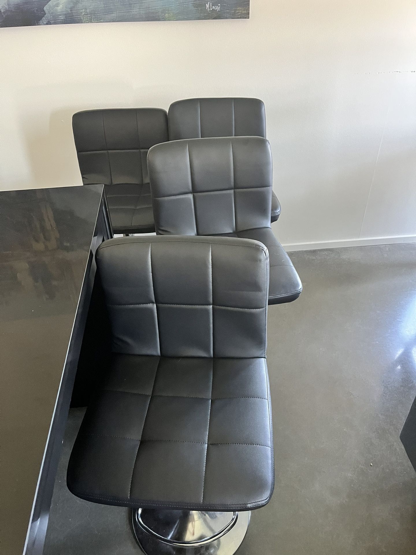 Four Adjustable Black Barstool Chairs
