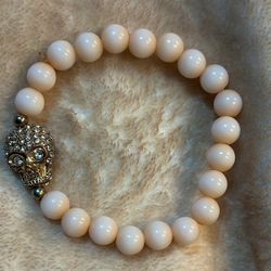 Light Pink Beaded Bracelet with Gold Skull Charm