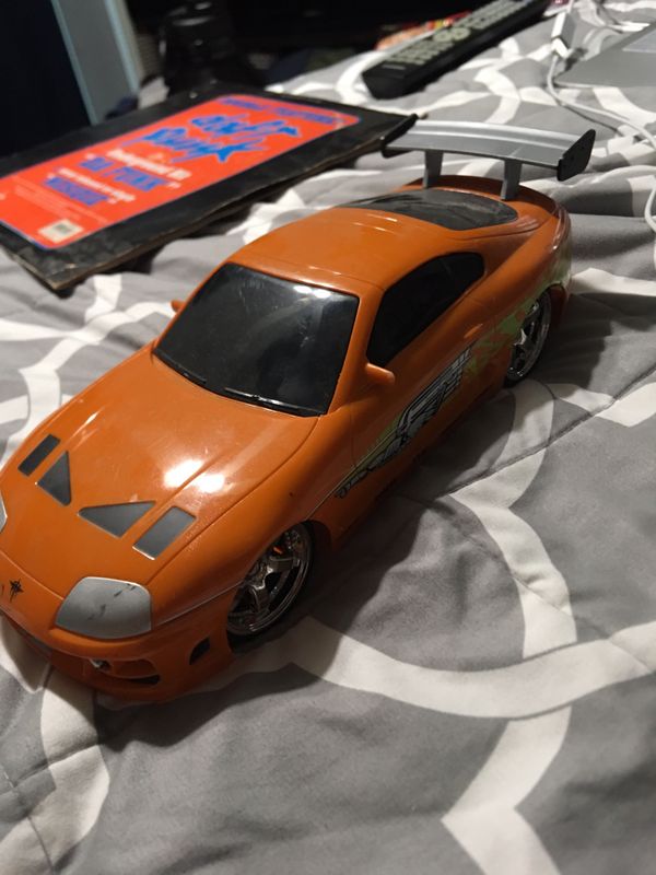 Jada fast and furious Toyota Supra 2 fast 2 furious car rc no controller for Sale in Irwindale