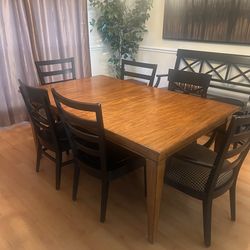 Wooden dining room table and chairs