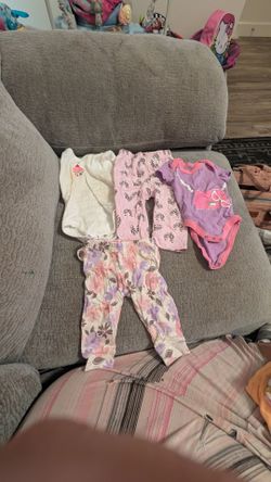 Baby girl clothes and pregnancy pillow