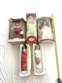 Collection of fine bisque, porcelain dolls. Some boxes are bent, but dolls are mint in box.