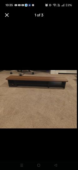 Wood veneer desk top monitor stand.