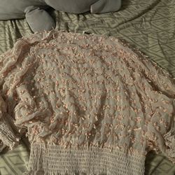 pink and white floral blouse with ruffles