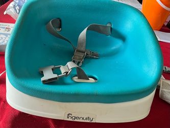Child booster seat for a chair