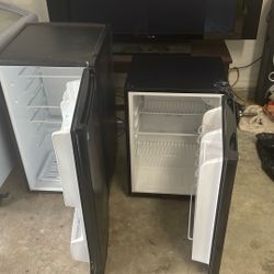 Two small refrigerators