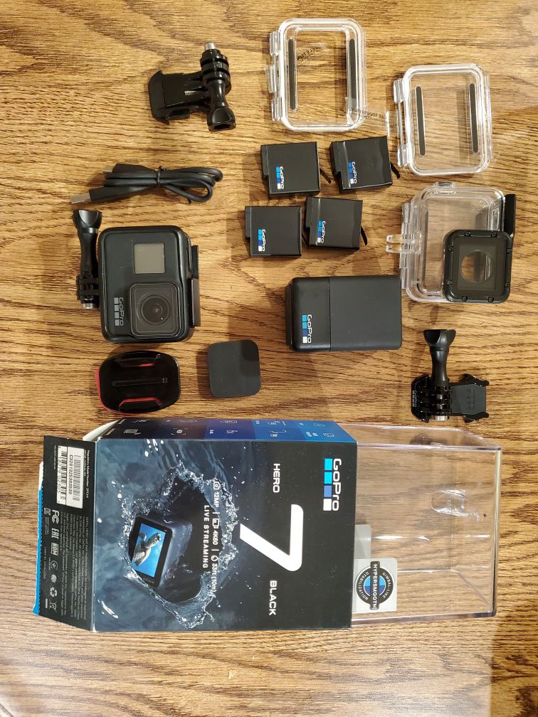 Gopro hero 7 black with accessories and four extra batteries