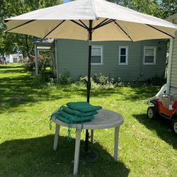 outdoor table with matching umbrella and cushions 