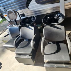 Two Shampoo Sinks With Attached Reclined Chairs And Adjustable Foot Rest