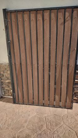 Black metal door gate wood panel.  Size 48" inches X. 72" inches tall.    $.  195.