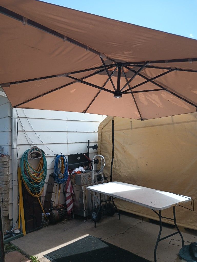 10 1/2' X 6' Rectangle Umbrella (Missing The Solar Panel For The Light) Base Can Be Filled With Sand Or Eater