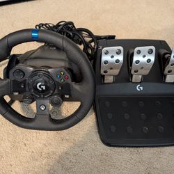 Logitech G923 Xbox racing simulator wheel and pedals.