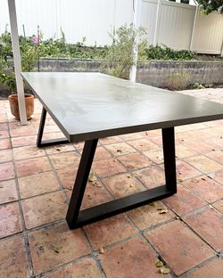 Concrete-Look Dining Table 78in x 37in with Black Steel Trapezoid Base