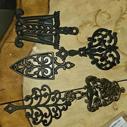 5 cast iron trivets  $50
