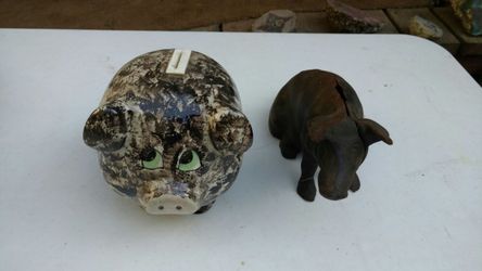 Two piggy banks 1 cast iron 1 ceramic