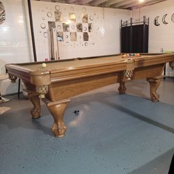 Pool table and pool sticks and pool 8 foot pool table.